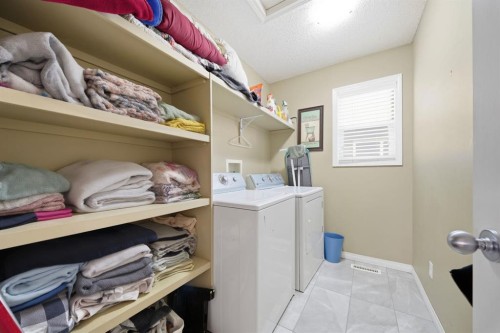 93 Copperleaf Way Se, Calgary, AB - Indoor Photo Showing Laundry Room