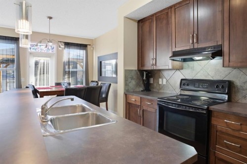 93 Copperleaf Way Se, Calgary, AB - Indoor Photo Showing Kitchen With Double Sink