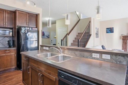 93 Copperleaf Way Se, Calgary, AB - Indoor Photo Showing Kitchen With Double Sink