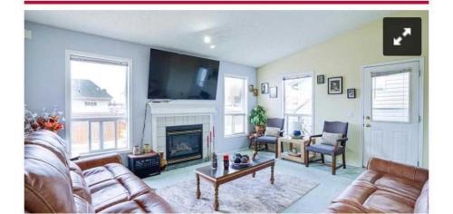 74 Tarlake Crescent, Calgary, AB - Indoor Photo Showing Living Room With Fireplace