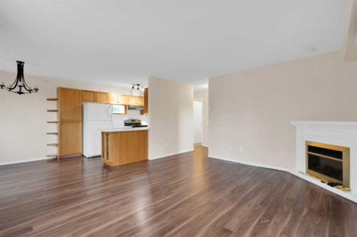 346-165 Manora Place Ne, Calgary, AB - Indoor With Fireplace