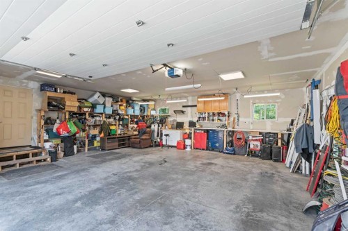 115 Dunham Lane, Diamond Valley, AB - Indoor Photo Showing Garage