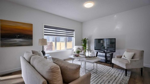 57 Willow Green Sw, Airdrie, AB - Indoor Photo Showing Living Room