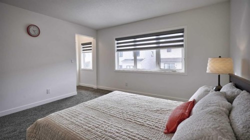 57 Willow Green Sw, Airdrie, AB - Indoor Photo Showing Bedroom