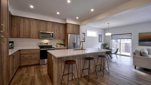 57 Willow Green Sw, Airdrie, AB - Indoor Photo Showing Kitchen With Upgraded Kitchen
