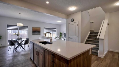 57 Willow Green Sw, Airdrie, AB - Indoor Photo Showing Kitchen With Double Sink With Upgraded Kitchen