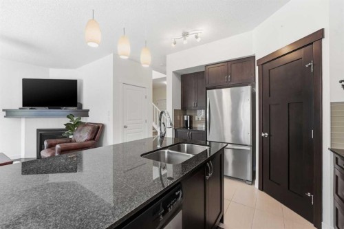 79 Cranford Green Se, Calgary, AB - Indoor Photo Showing Kitchen With Stainless Steel Kitchen With Double Sink With Upgraded Kitchen