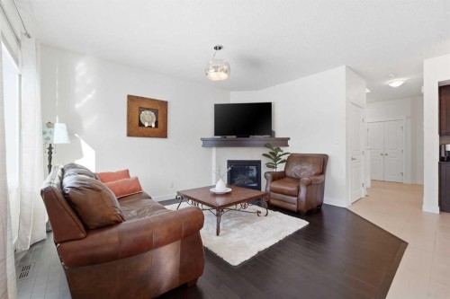 79 Cranford Green Se, Calgary, AB - Indoor Photo Showing Living Room With Fireplace