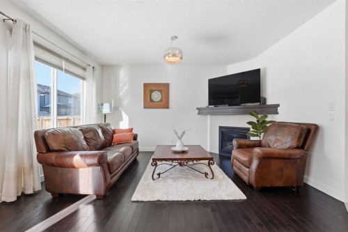 79 Cranford Green Se, Calgary, AB - Indoor Photo Showing Living Room With Fireplace