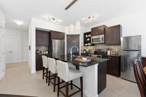 79 Cranford Green Se, Calgary, AB - Indoor Photo Showing Kitchen With Stainless Steel Kitchen With Upgraded Kitchen