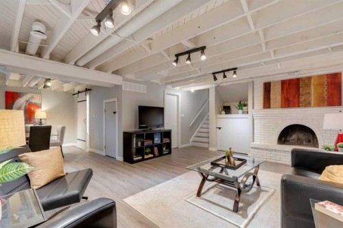 4023 Varmoor Road Nw, Calgary, AB - Indoor Photo Showing Living Room With Fireplace