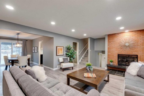 4023 Varmoor Road Nw, Calgary, AB - Indoor Photo Showing Living Room With Fireplace