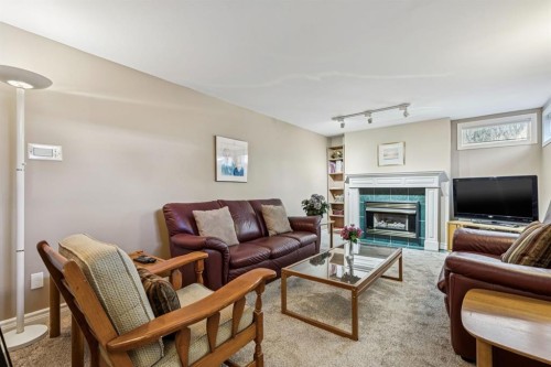 3347 Upton Place Nw, Calgary, AB - Indoor Photo Showing Living Room With Fireplace