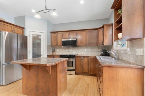 52 Glensummit Close, Cochrane, AB - Indoor Photo Showing Kitchen With Double Sink