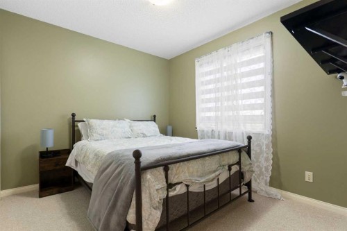 52 Glensummit Close, Cochrane, AB - Indoor Photo Showing Bedroom
