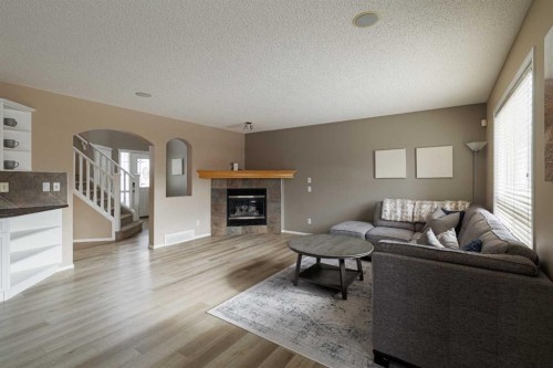51 Brightondale Crescent Se, Calgary, AB - Indoor Photo Showing Living Room With Fireplace
