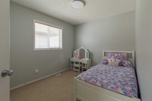 51 Brightondale Crescent Se, Calgary, AB - Indoor Photo Showing Bedroom