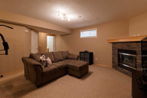 51 Brightondale Crescent Se, Calgary, AB - Indoor Photo Showing Other Room With Fireplace