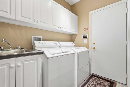 23 Prominence Point Sw, Calgary, AB - Indoor Photo Showing Laundry Room