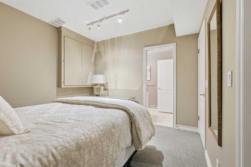 23 Prominence Point Sw, Calgary, AB - Indoor Photo Showing Bedroom