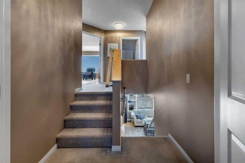 133 Rocky Ridge Heath Nw, Calgary, AB - Indoor Photo Showing Other Room