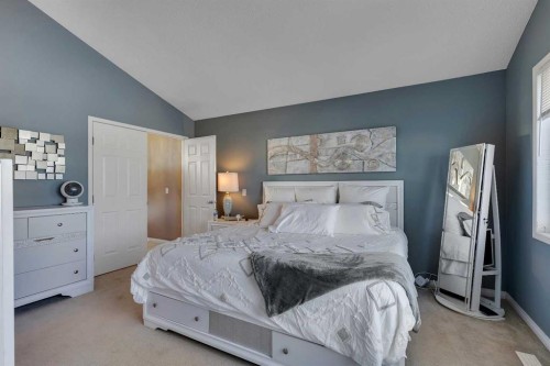 133 Rocky Ridge Heath Nw, Calgary, AB - Indoor Photo Showing Bedroom