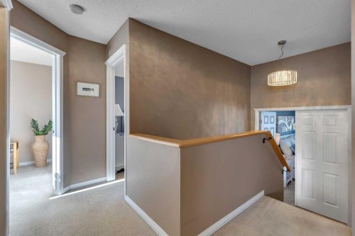 133 Rocky Ridge Heath Nw, Calgary, AB - Indoor Photo Showing Other Room