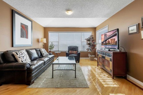 133 Rocky Ridge Heath Nw, Calgary, AB - Indoor Photo Showing Living Room