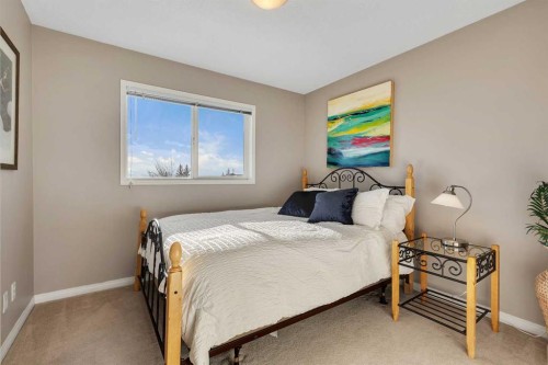 133 Rocky Ridge Heath Nw, Calgary, AB - Indoor Photo Showing Bedroom