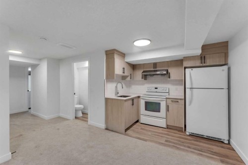 199 Cedardale Road Sw, Calgary, AB - Indoor Photo Showing Kitchen