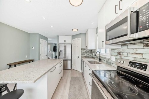 883 Arbour Lake Road Nw, Calgary, AB - Indoor Photo Showing Kitchen With Upgraded Kitchen