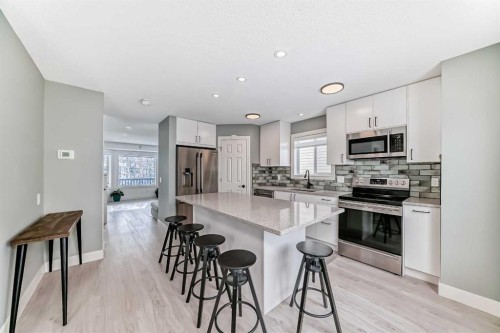 883 Arbour Lake Road Nw, Calgary, AB - Indoor Photo Showing Kitchen With Upgraded Kitchen
