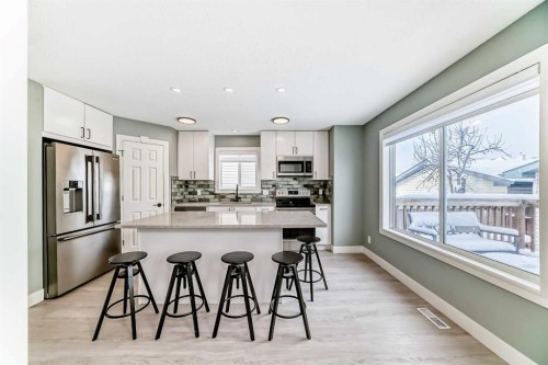883 Arbour Lake Road Nw, Calgary, AB - Indoor Photo Showing Kitchen With Upgraded Kitchen
