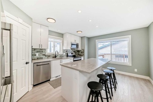 883 Arbour Lake Road Nw, Calgary, AB - Indoor Photo Showing Kitchen With Upgraded Kitchen