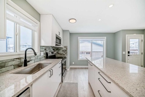 883 Arbour Lake Road Nw, Calgary, AB - Indoor Photo Showing Kitchen With Upgraded Kitchen
