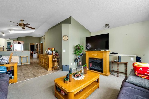 172 Prestwick Heights Se, Calgary, AB - Indoor Photo Showing Living Room With Fireplace
