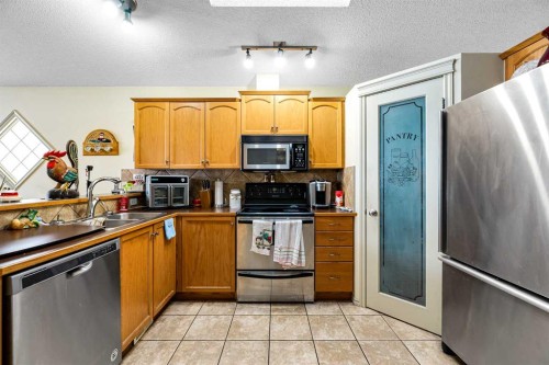 172 Prestwick Heights Se, Calgary, AB - Indoor Photo Showing Kitchen With Double Sink