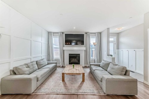 129 Lucas Crescent Nw, Calgary, AB - Indoor Photo Showing Living Room With Fireplace