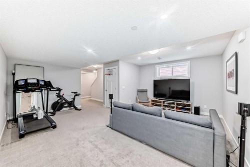 129 Lucas Crescent Nw, Calgary, AB - Indoor Photo Showing Gym Room