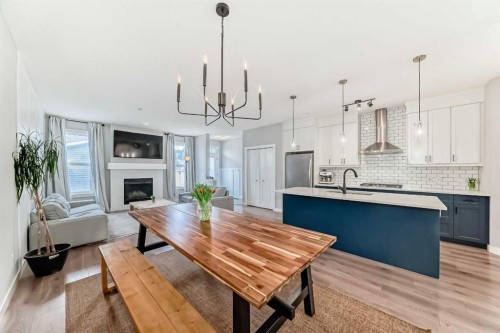 129 Lucas Crescent Nw, Calgary, AB - Indoor Photo Showing Kitchen With Fireplace With Upgraded Kitchen