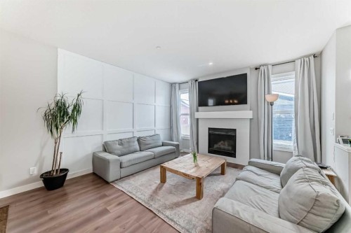 129 Lucas Crescent Nw, Calgary, AB - Indoor Photo Showing Living Room With Fireplace