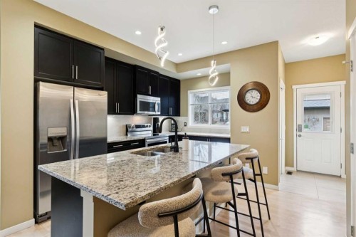 305 Mahogany Boulevard Se, Calgary, AB - Indoor Photo Showing Kitchen With Double Sink With Upgraded Kitchen