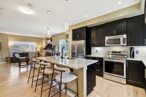 305 Mahogany Boulevard Se, Calgary, AB - Indoor Photo Showing Kitchen With Double Sink With Upgraded Kitchen