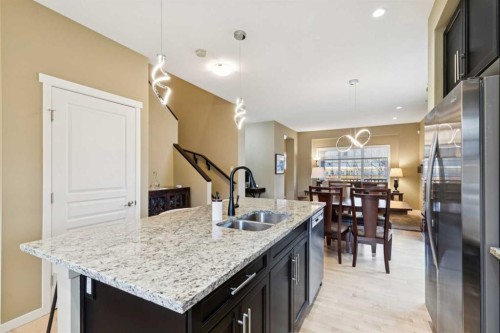 305 Mahogany Boulevard Se, Calgary, AB - Indoor Photo Showing Kitchen With Double Sink With Upgraded Kitchen