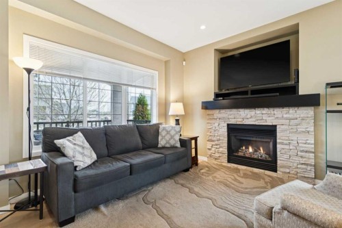 305 Mahogany Boulevard Se, Calgary, AB - Indoor Photo Showing Living Room With Fireplace