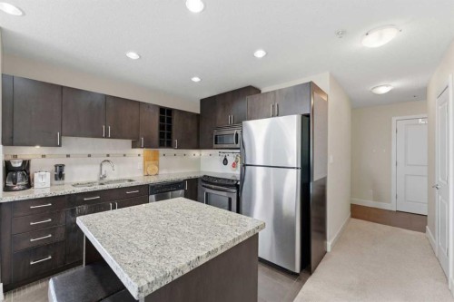 702-77 Spruce Place Sw, Calgary, AB - Indoor Photo Showing Kitchen