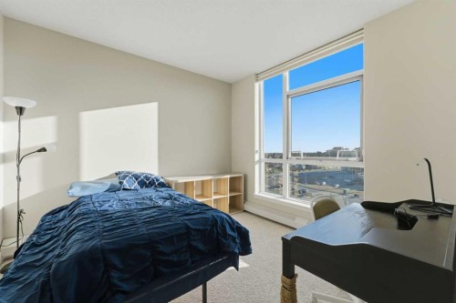 702-77 Spruce Place Sw, Calgary, AB - Indoor Photo Showing Bedroom
