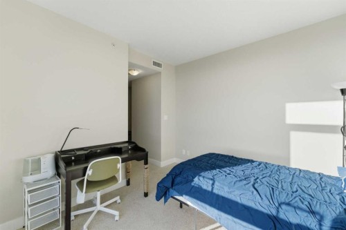 702-77 Spruce Place Sw, Calgary, AB - Indoor Photo Showing Bedroom