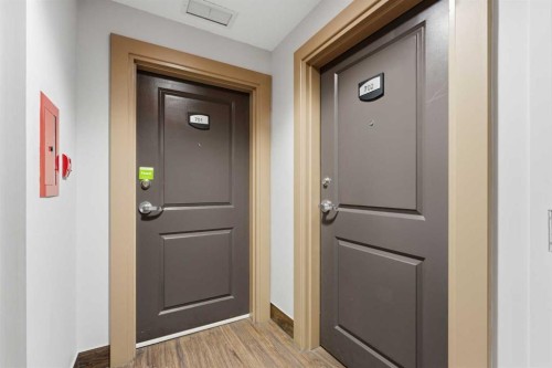 702-77 Spruce Place Sw, Calgary, AB - Indoor Photo Showing Other Room