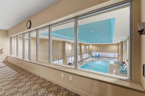 702-77 Spruce Place Sw, Calgary, AB - Indoor Photo Showing Other Room